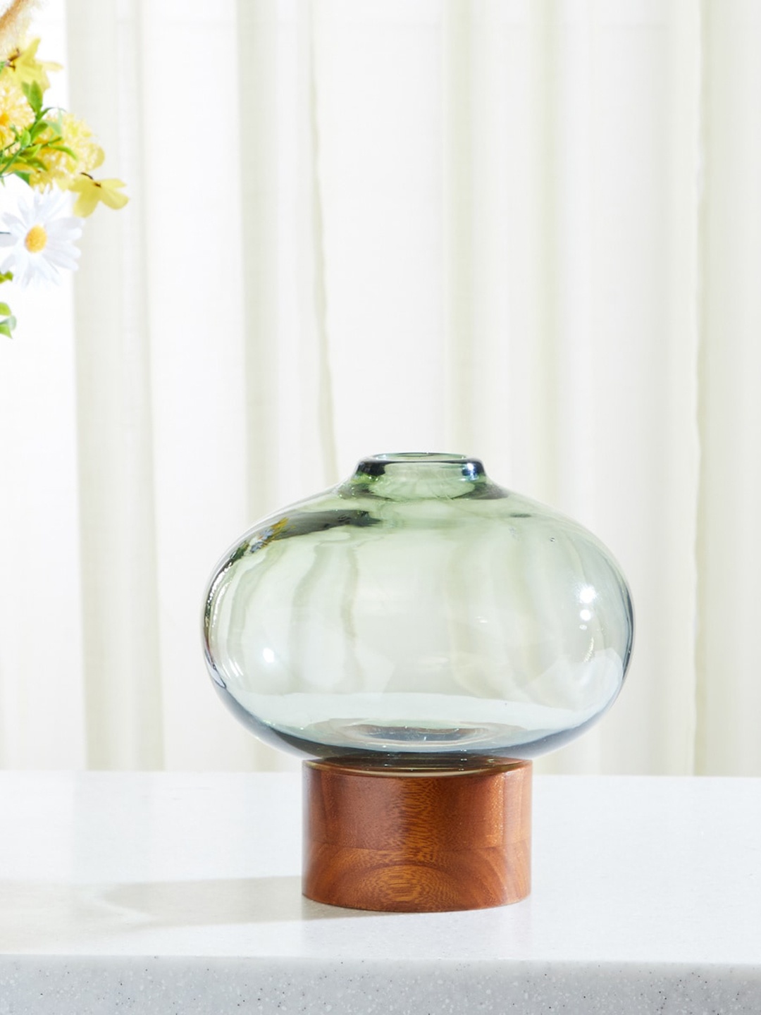 

Home Centre Green & Brown Glass Vase With Wooden Base