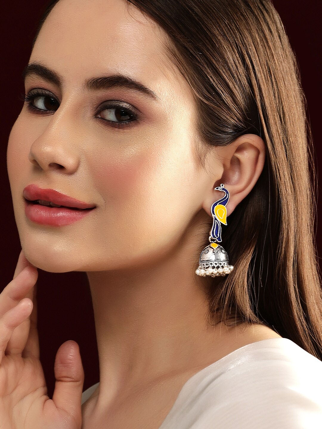 

Rubans Oxidized Silver Plated Peacock Shaped Blue & Yellow Enamelld Pearl Beaded Jhumkas