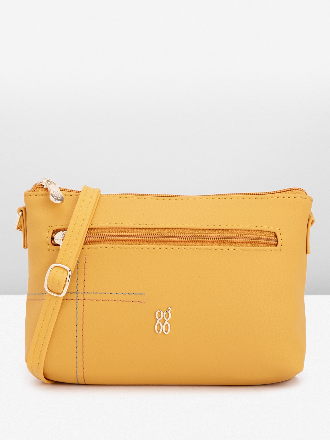 

Baggit Solid PU Structured Sling Bag With Minimal Thread Work Detail, Yellow