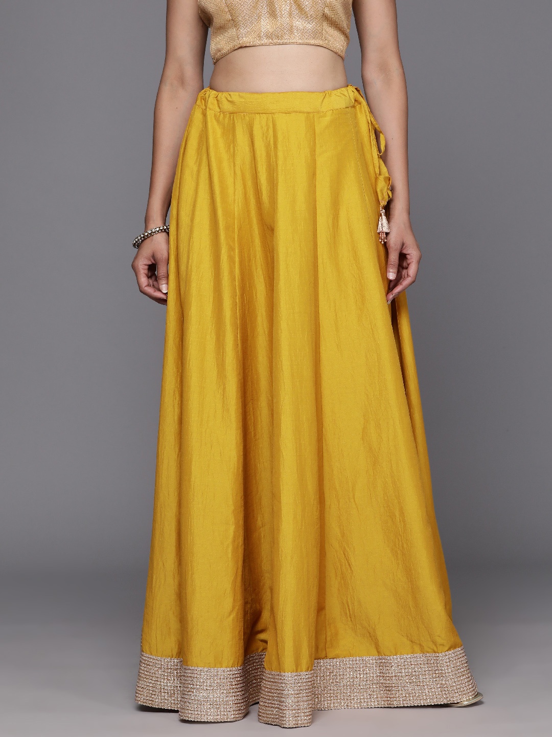 

Varanga Mustard Solid Panelled Embellished Skirt