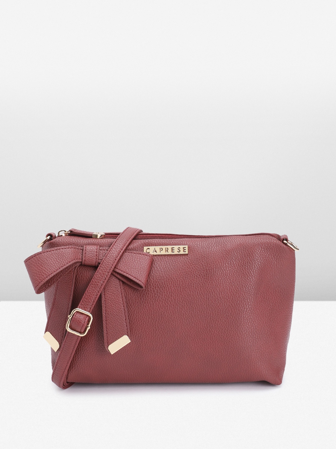 

Caprese Abstract Textured Sling Bag with Bow Detail, Maroon