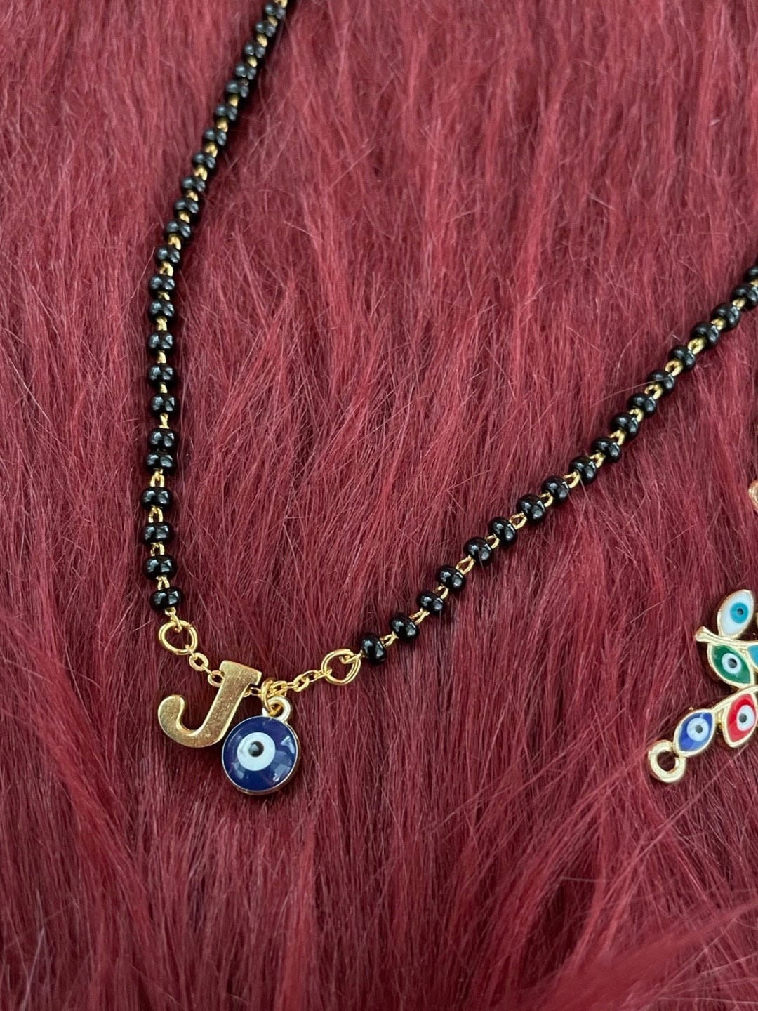 

Digital Dress Room Gold-Plated Beaded J Letter Alphabet Evil Eye Mangalsutra