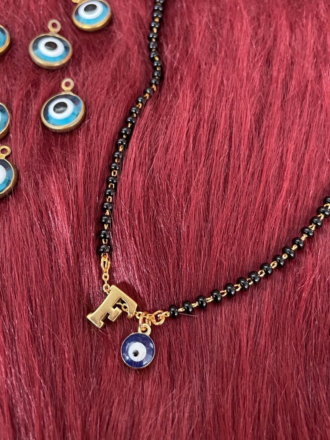 

Digital Dress Room Gold-Plated Beaded F Letter Alphabet Evil Eye Mangalsutra