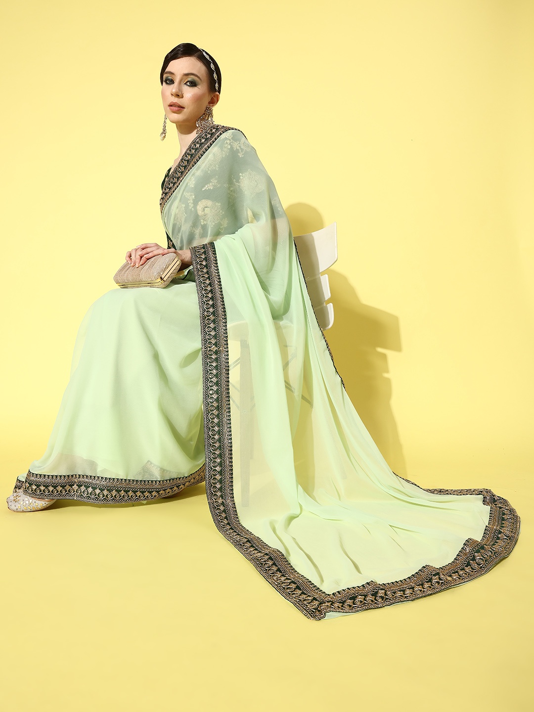 

Mitera Green Embellished Embroidered Pure Georgette Saree