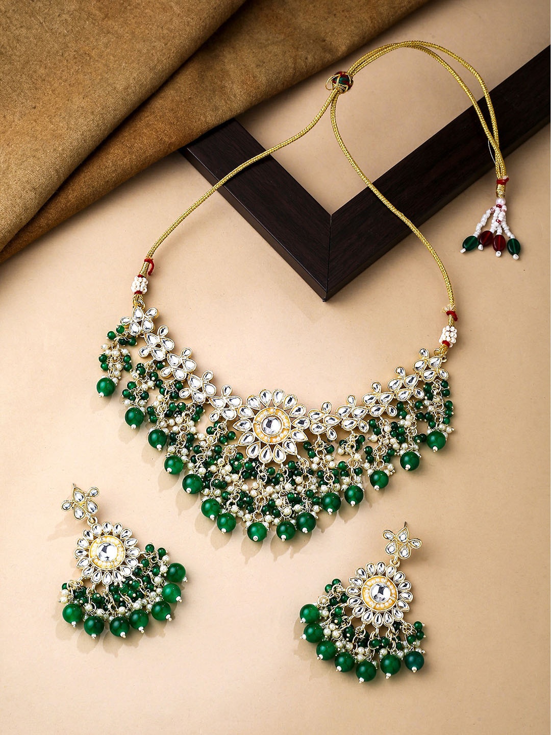 

Yellow Chimes Gold-Plated Kundan Studded & Pearl Beaded Necklace and Earrings