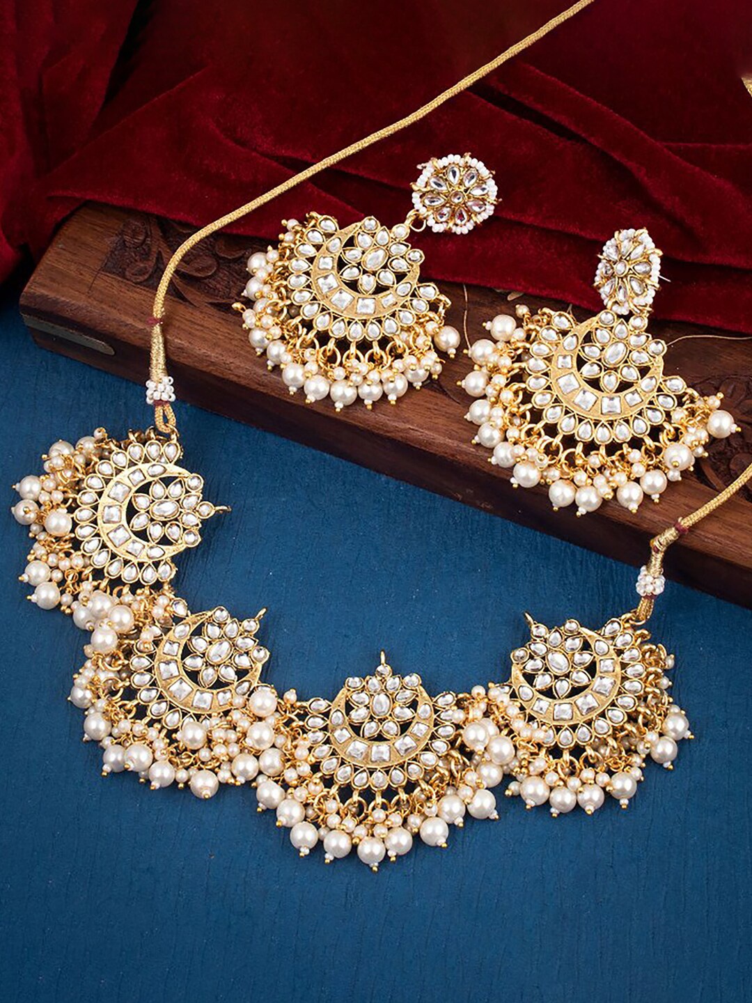 

Sukkhi Gold-Plated Stone-Studded & Beaded Jewellery Set