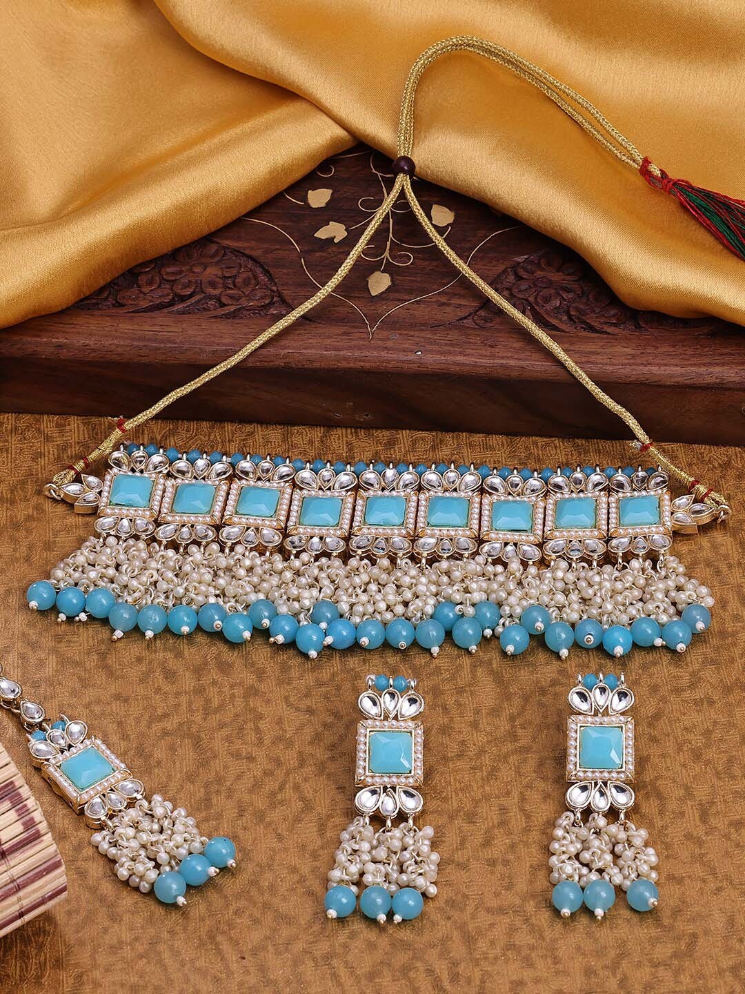 

Sukkhi Gold-Plated Stone-Studded & Beaded Jewellery Set With Maang Tikka