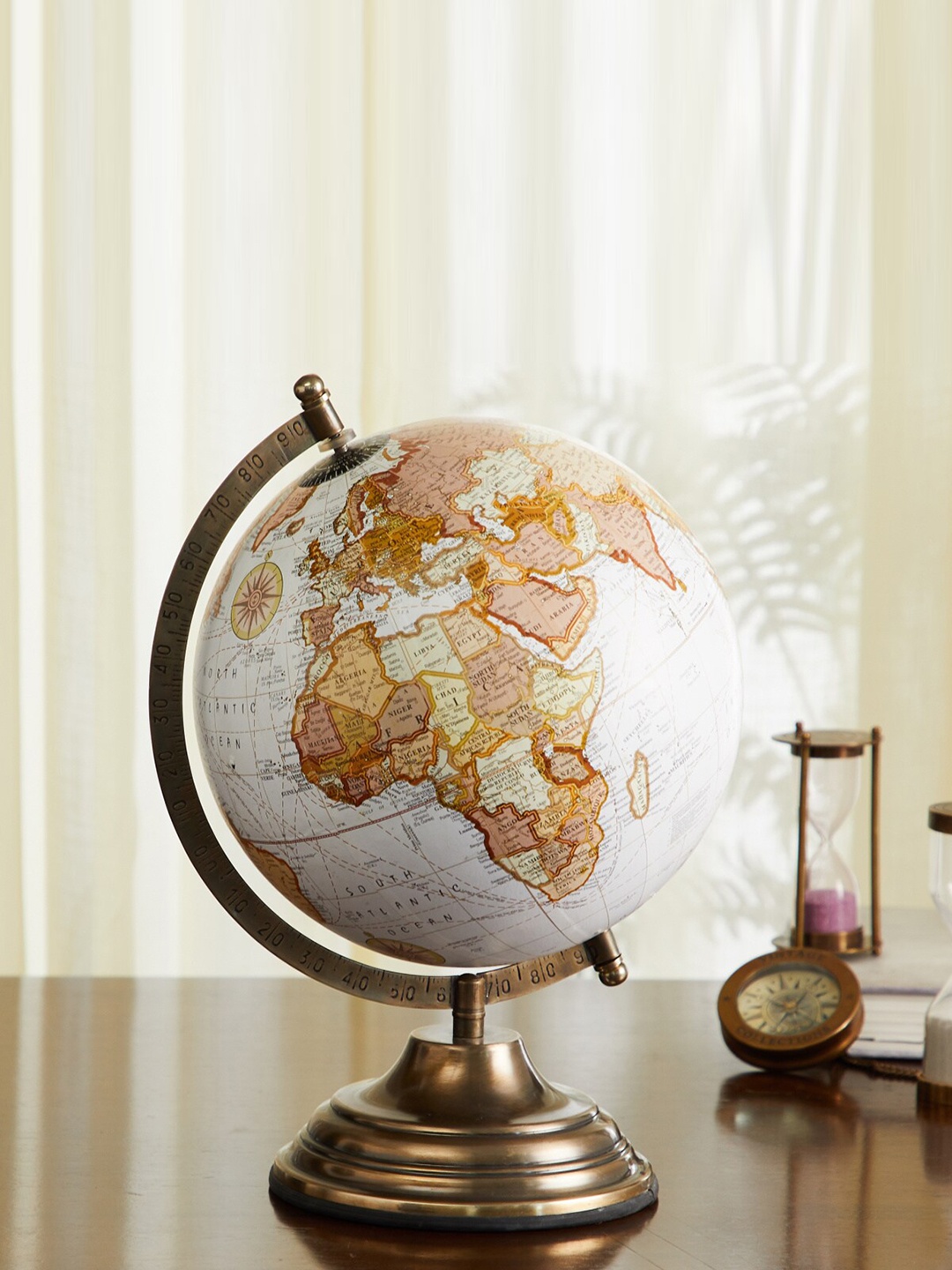 

Home Centre White & Beige Globe Table Accent Showpiece