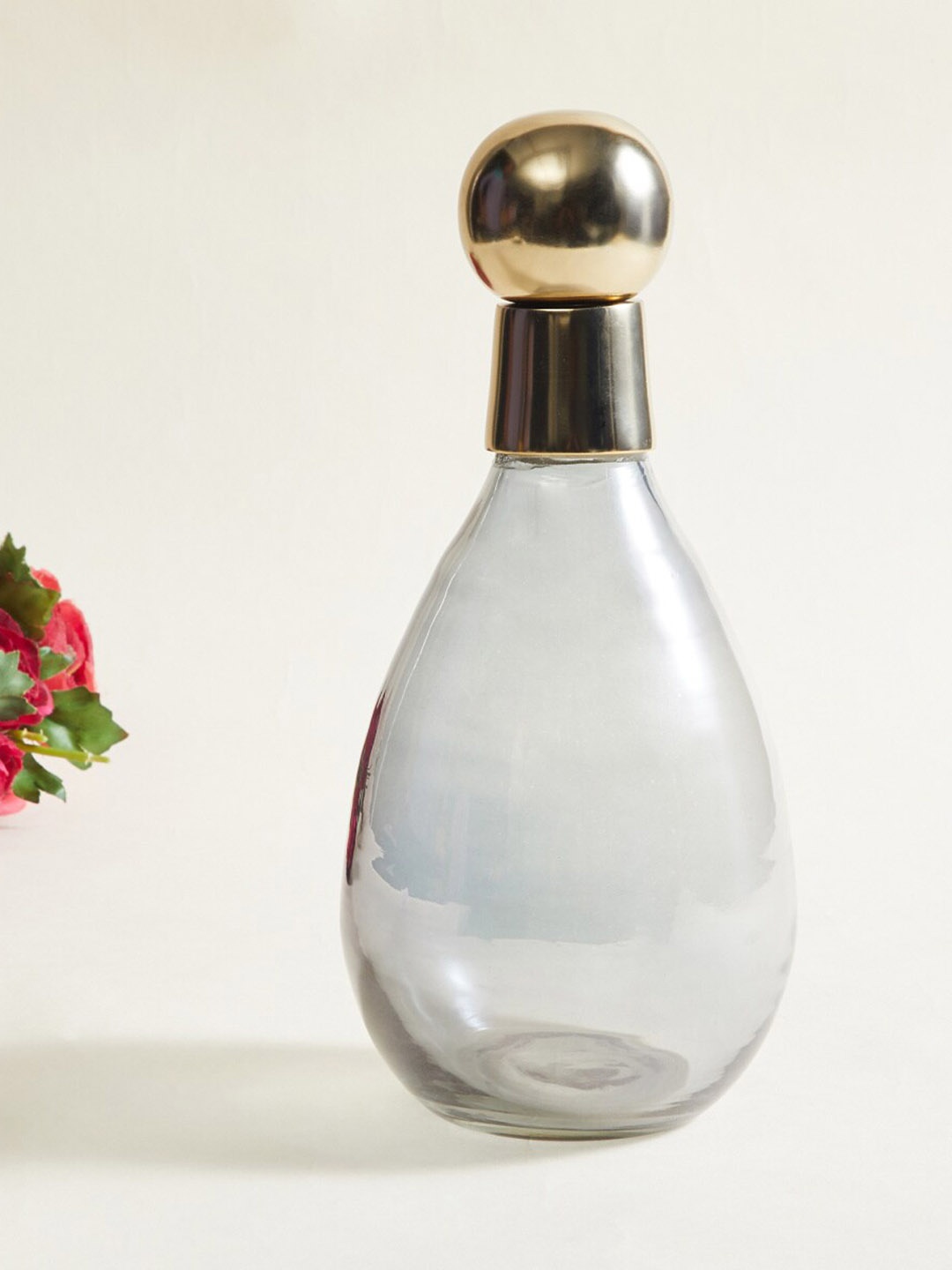 

Home Centre Transparent Glass Canister With Metal Lid