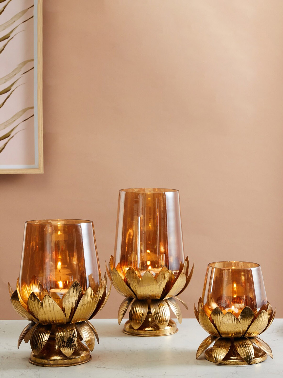 

Home Centre Gold-Toned Rylee Glass T-Light Holder With Lotus Metal Base