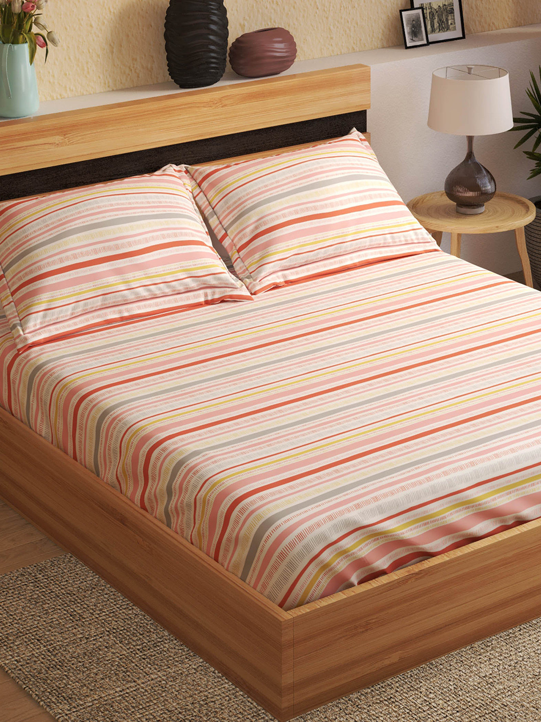 

Home Centre Peach & Yellow Striped 144 TC Fitted Cotton King Bedsheet with 2 Pillow Covers