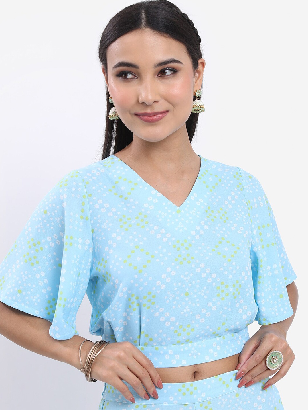 

Vishudh Blue Floral Printed Flared Sleeves Blouson Crop Top