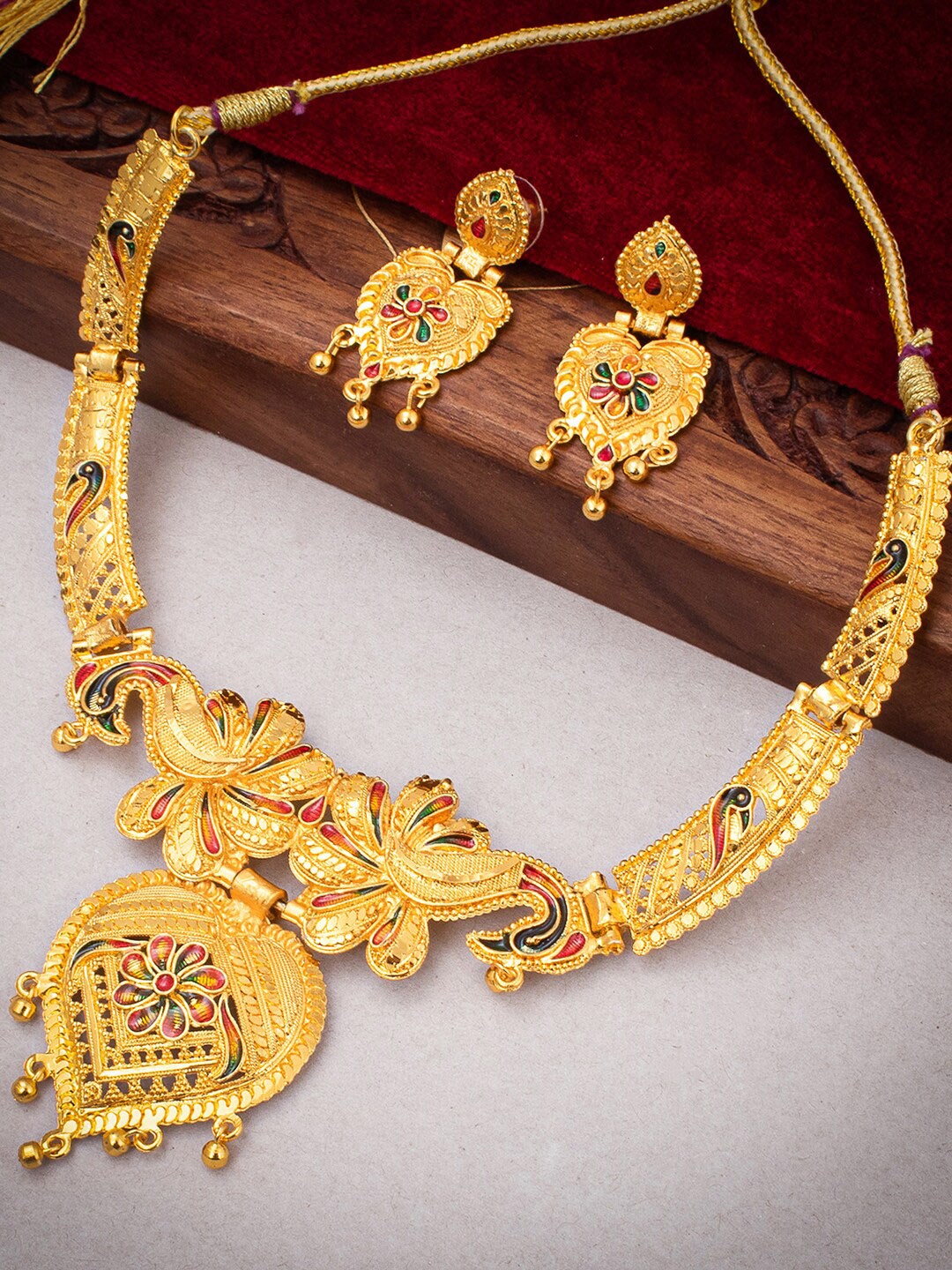 

Sukkhi Gold-Plated Enamelled Ethnic Motif Charm Necklace & Earrings