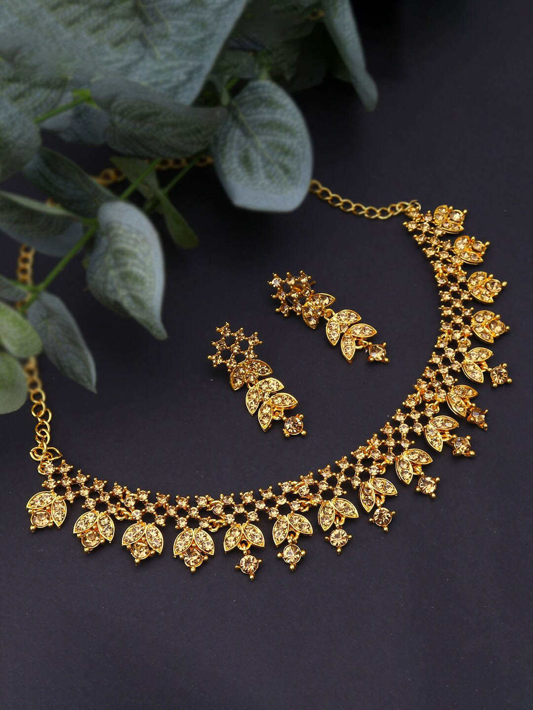 

Sukkhi Gold-Plated Stone-Studded Necklace And Earrings Jewellery Set