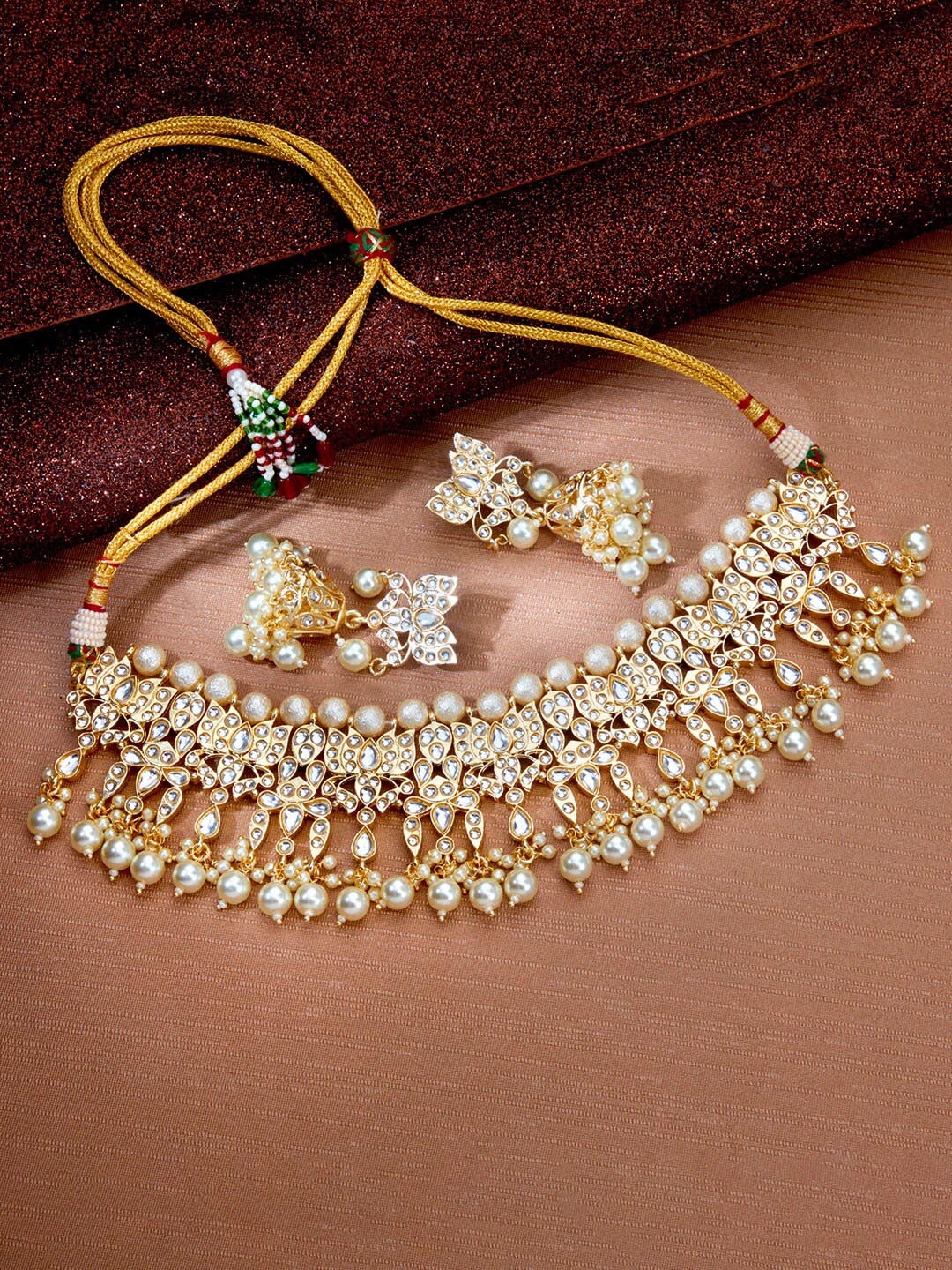 

Sukkhi Gold-Plated Kundan-Studded & Beaded Necklace and Earrings Jewellery Set