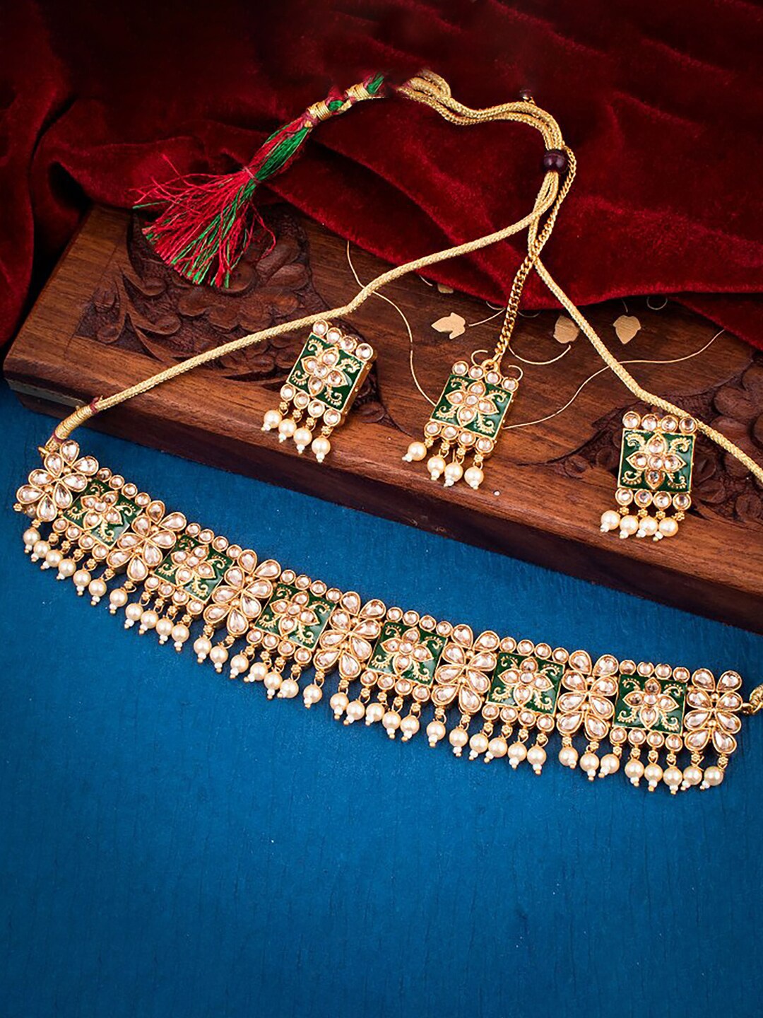 

Sukkhi Gold-Plated Stone-Studded Necklace And Earrings With Maang Tika Jewellery Set