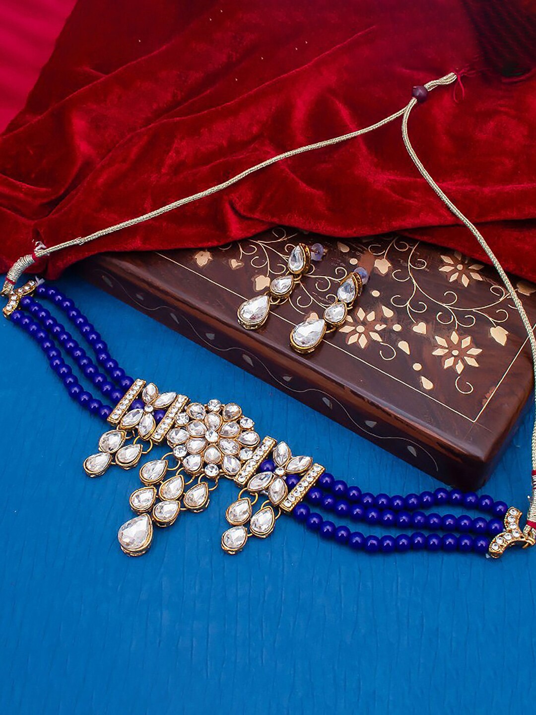 

Sukkhi Gold-Plated Kundan-Studded & Pearl Beaded Jewellery Set