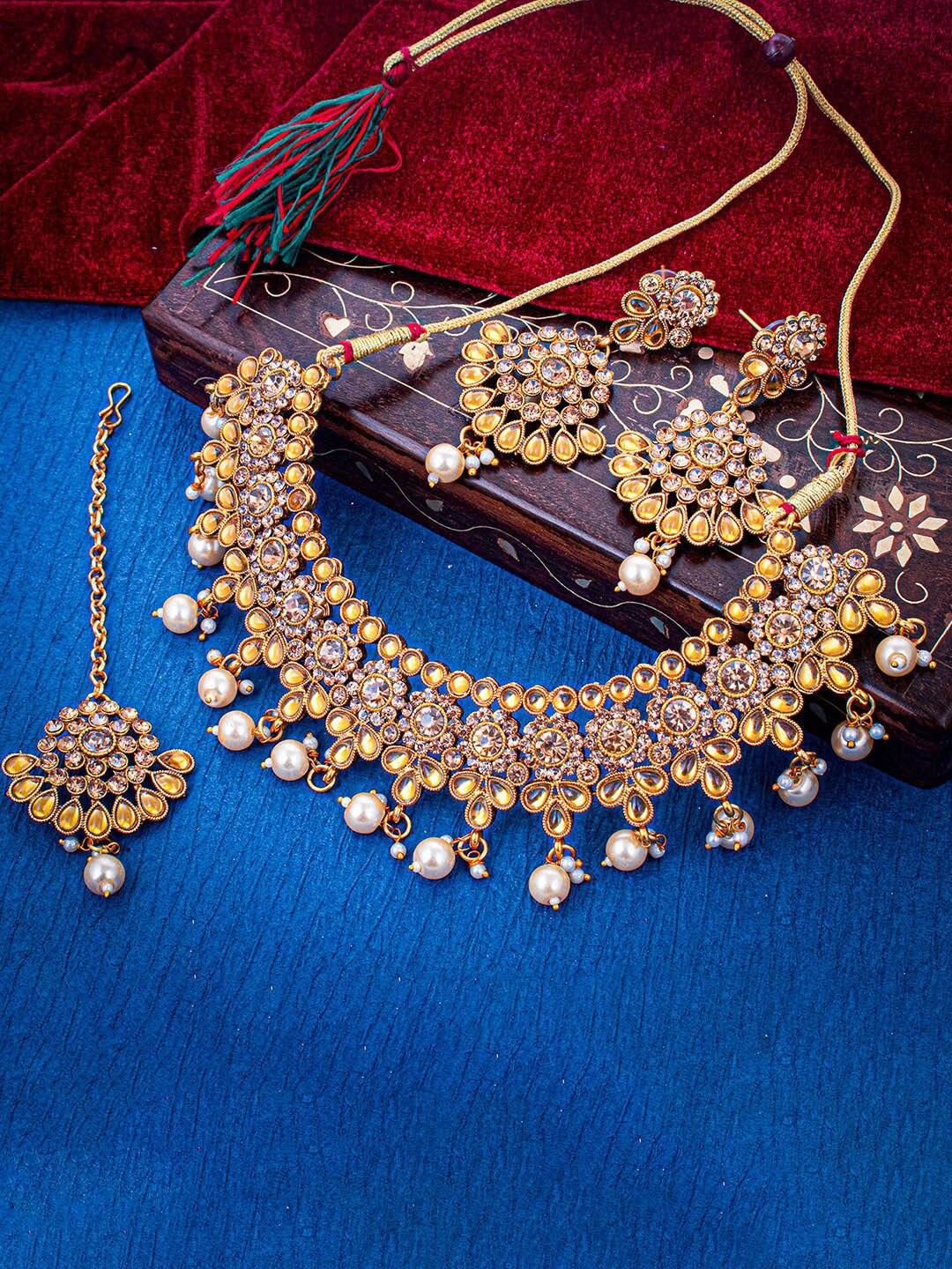 

Sukkhi Gold-Plated Stone Studded & Beaded Jewellery Set