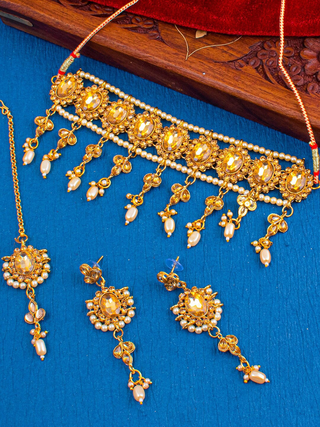 

Sukkhi Gold-Plated Stone-Studded Necklace and Earrings With Maang Tika Jewellery Set