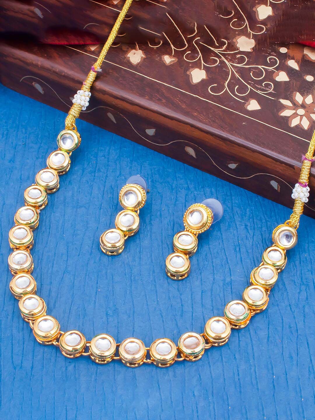 

Sukkhi Gold-Plated Kundan-Studded Necklace and Earrings Jewellery Set
