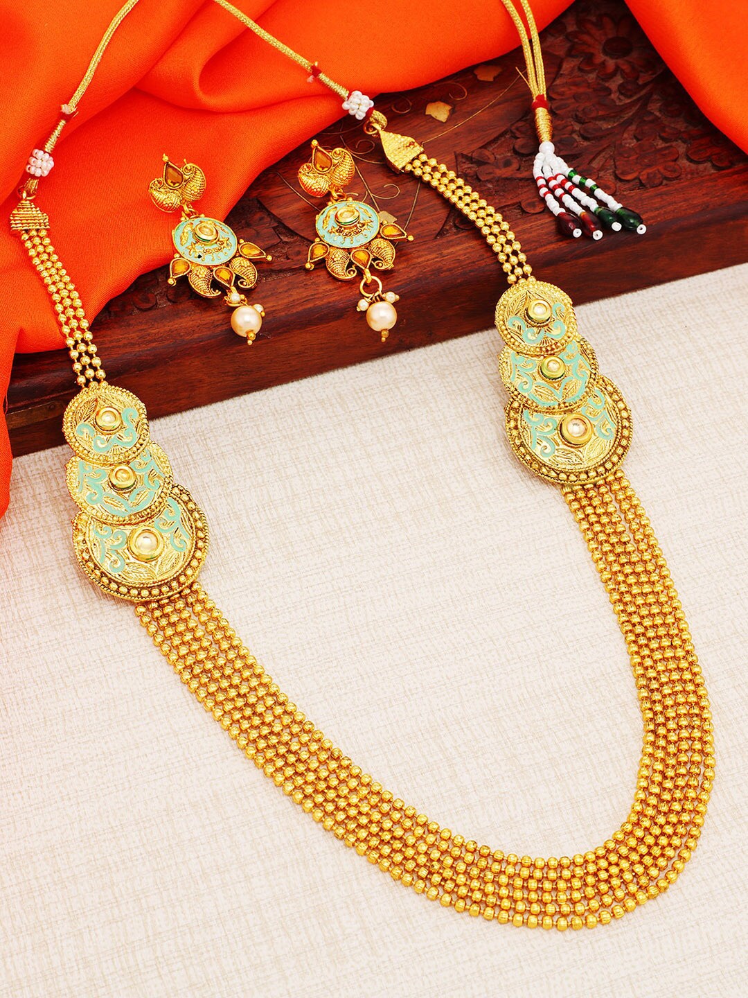 

Sukkhi Gold-Plated Stone-Studded & Beaded Necklace and Earrings Jewellery Set