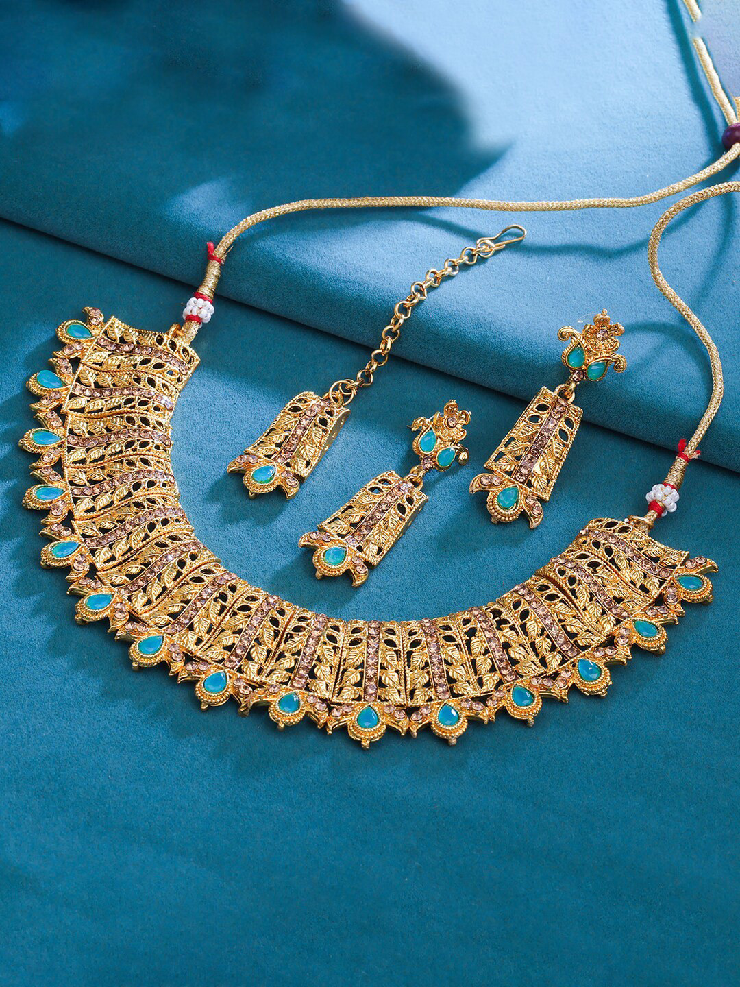 

Sukkhi Gold-Plated Stone-Studded Necklace and Earrings With Maang Tika Jewellery Set