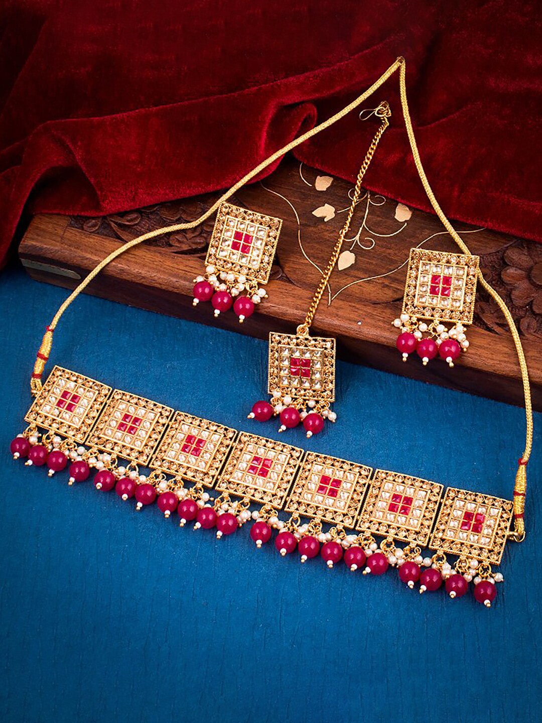 

Sukkhi Gold-Plated Stone-Studded Necklace and Earrings With Maang Tika Jewellery Set