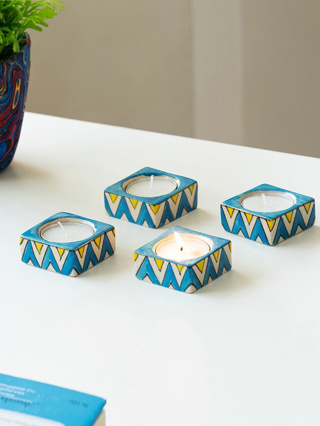 

ExclusiveLane Mughal Zig-Zag Jugnu 4 Pieces Blue Printed Tea Light Holder