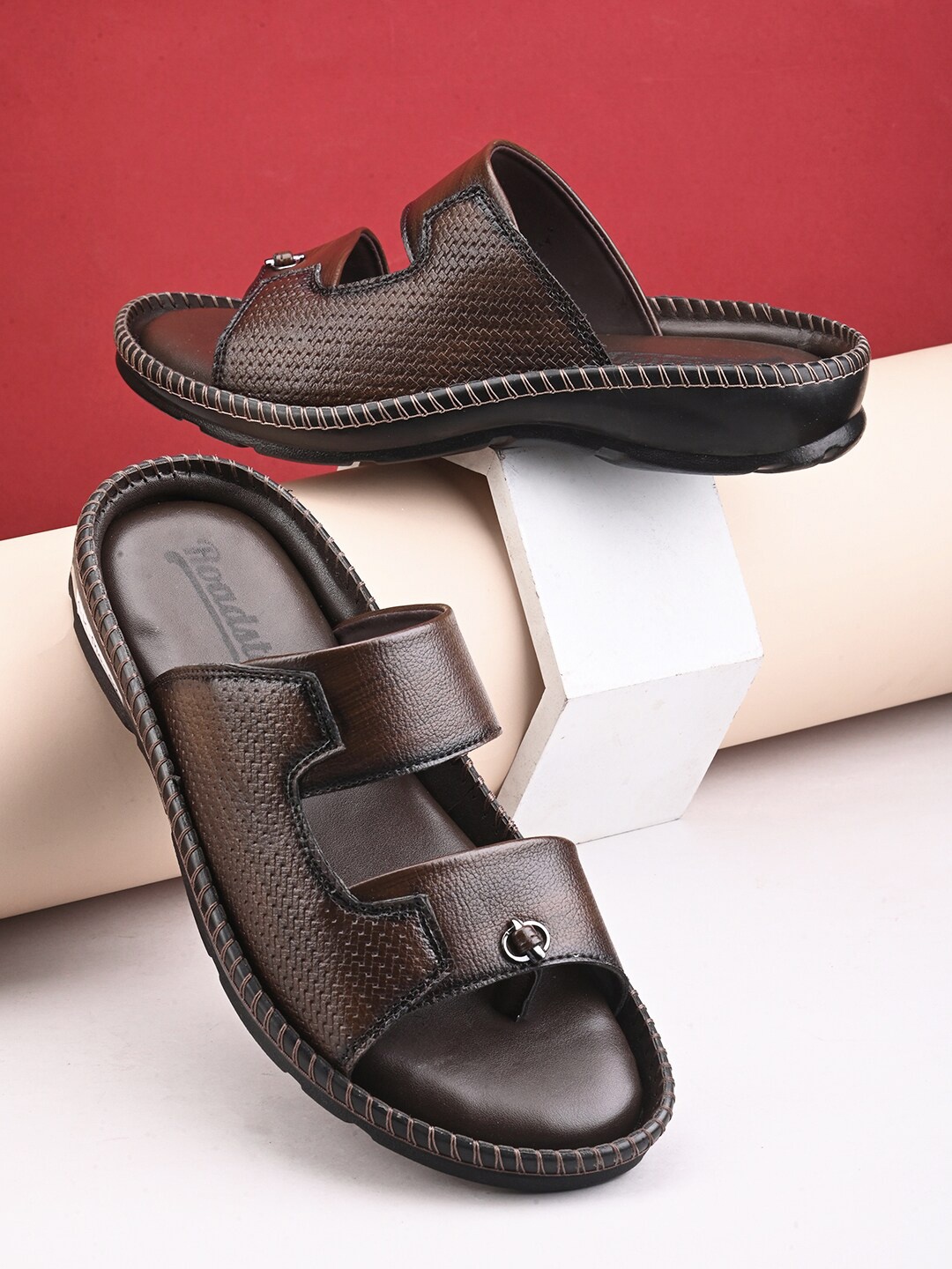 

Roadster Men Brown Textured Slip On Open Toes Comfort Sandals