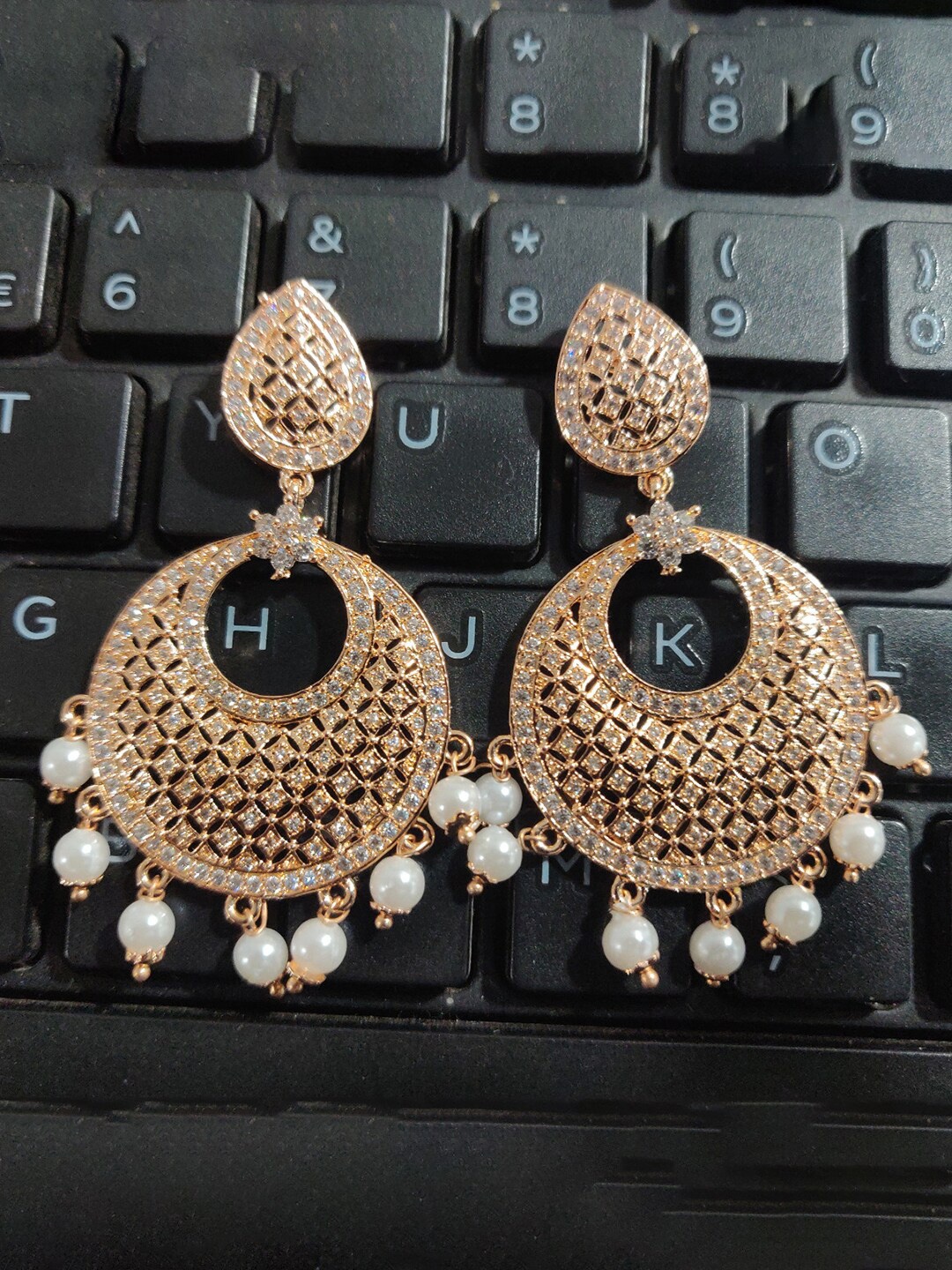 

Sukkhi Rose Gold Plated Contemporary Drop Earrings