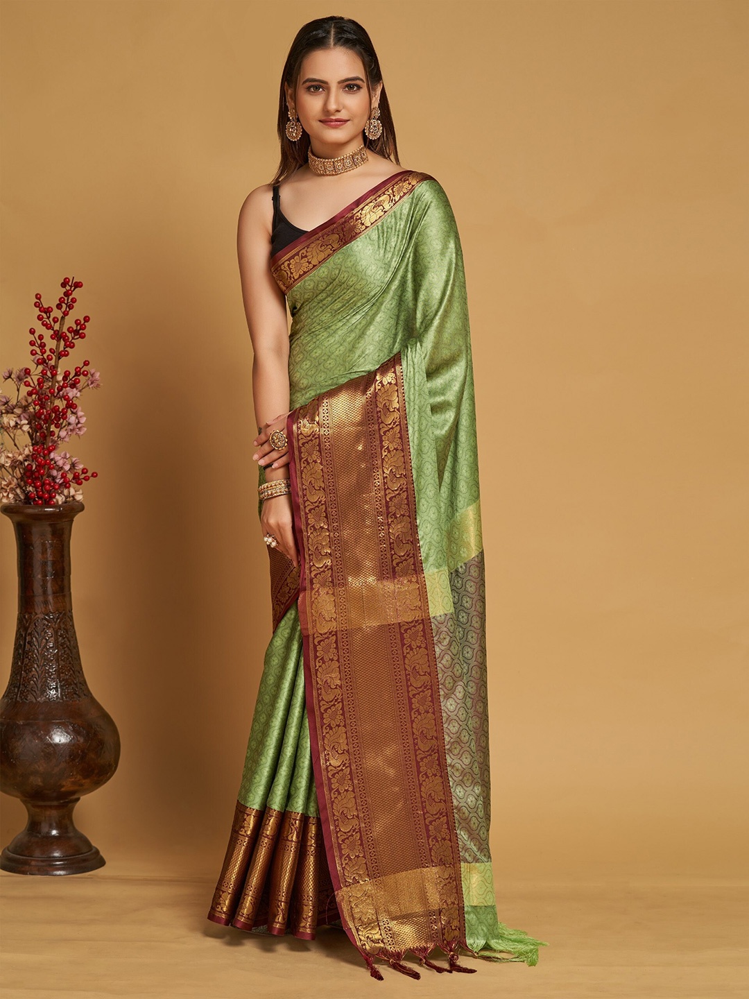 

Mitera Green & Purple Ethnic Motifs Woven Design Zari Silk Cotton Banarasi Saree