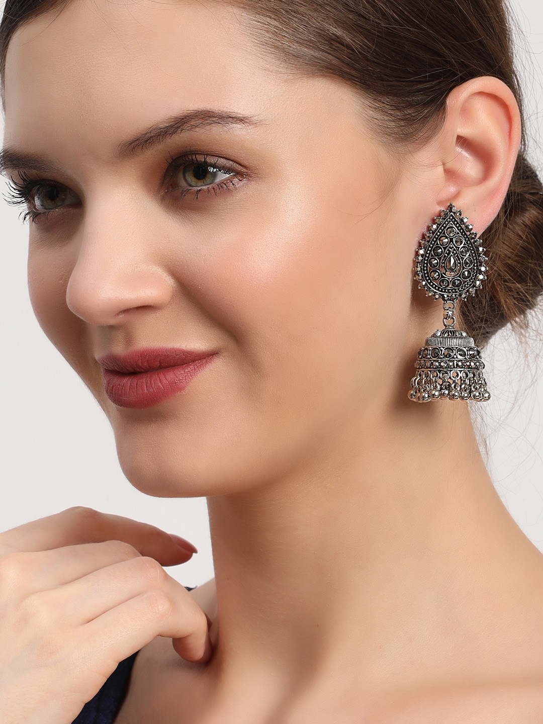 

Anouk Silver-Plated Dome Shaped Silver-Toned Jhumkas Earrings