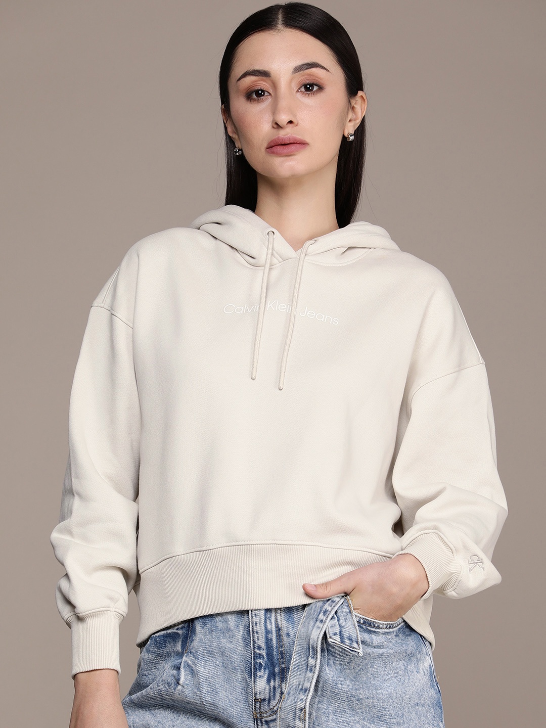 

Calvin Klein Jeans Women Solid Long Sleeves Hooded Sweatshirt, Beige