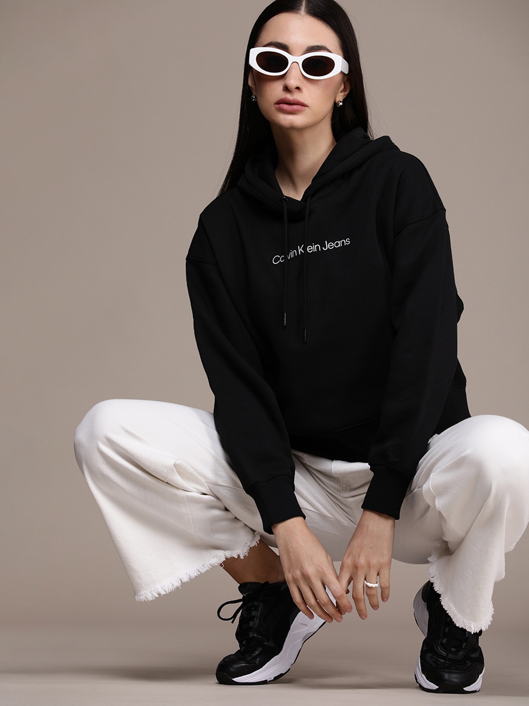 

Calvin Klein Jeans Women Solid Long Sleeves Hooded Sweatshirt, Black