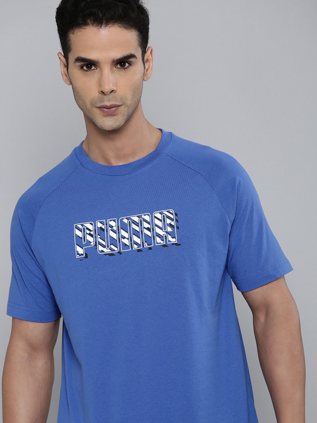 

Puma Brand Logo Print Dyna-Mix Graphic Raglan Sleeves Regular Fit Knitted T-Shirt, Blue