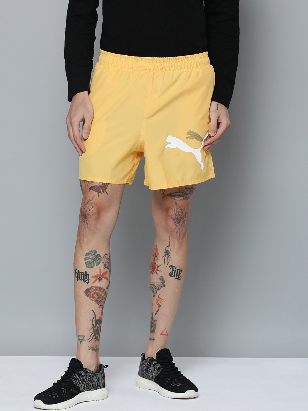 

Puma Men Solid Mid Rise Essential+ LOGO POWER Woven Outdoor Sports Shorts, Yellow