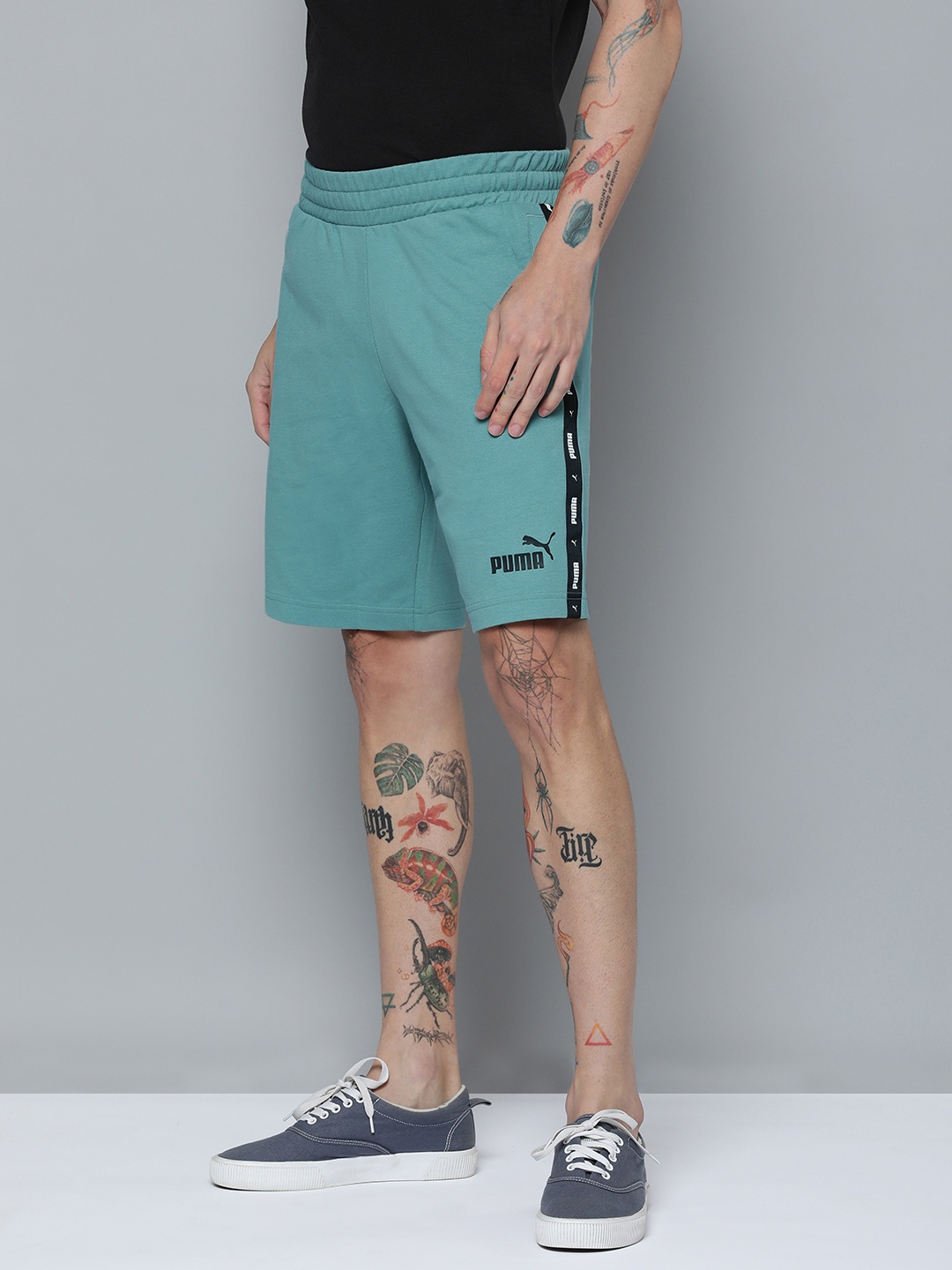 

Puma Men Mid-Rise Essential+Tape 9" Regular Fit Outdoor Shorts, Blue
