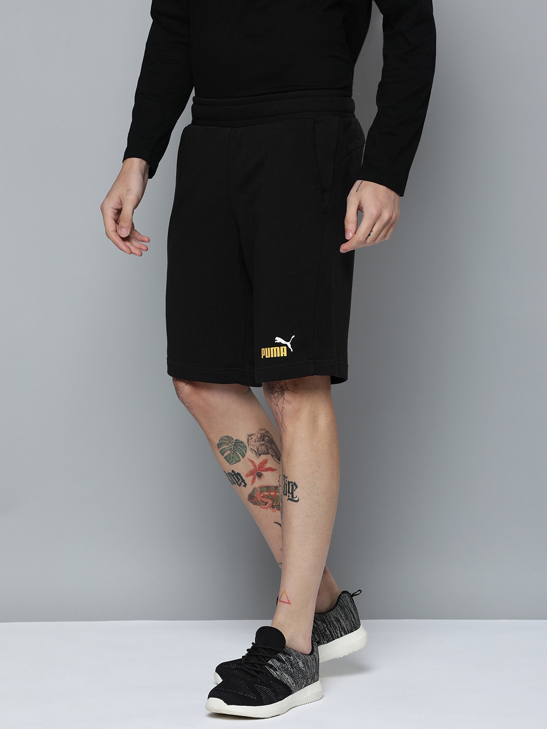 

Puma Men Solid Regular Fit Mid-Rise Essentials+ Two-Tone Outdoor Sports Shorts, Black