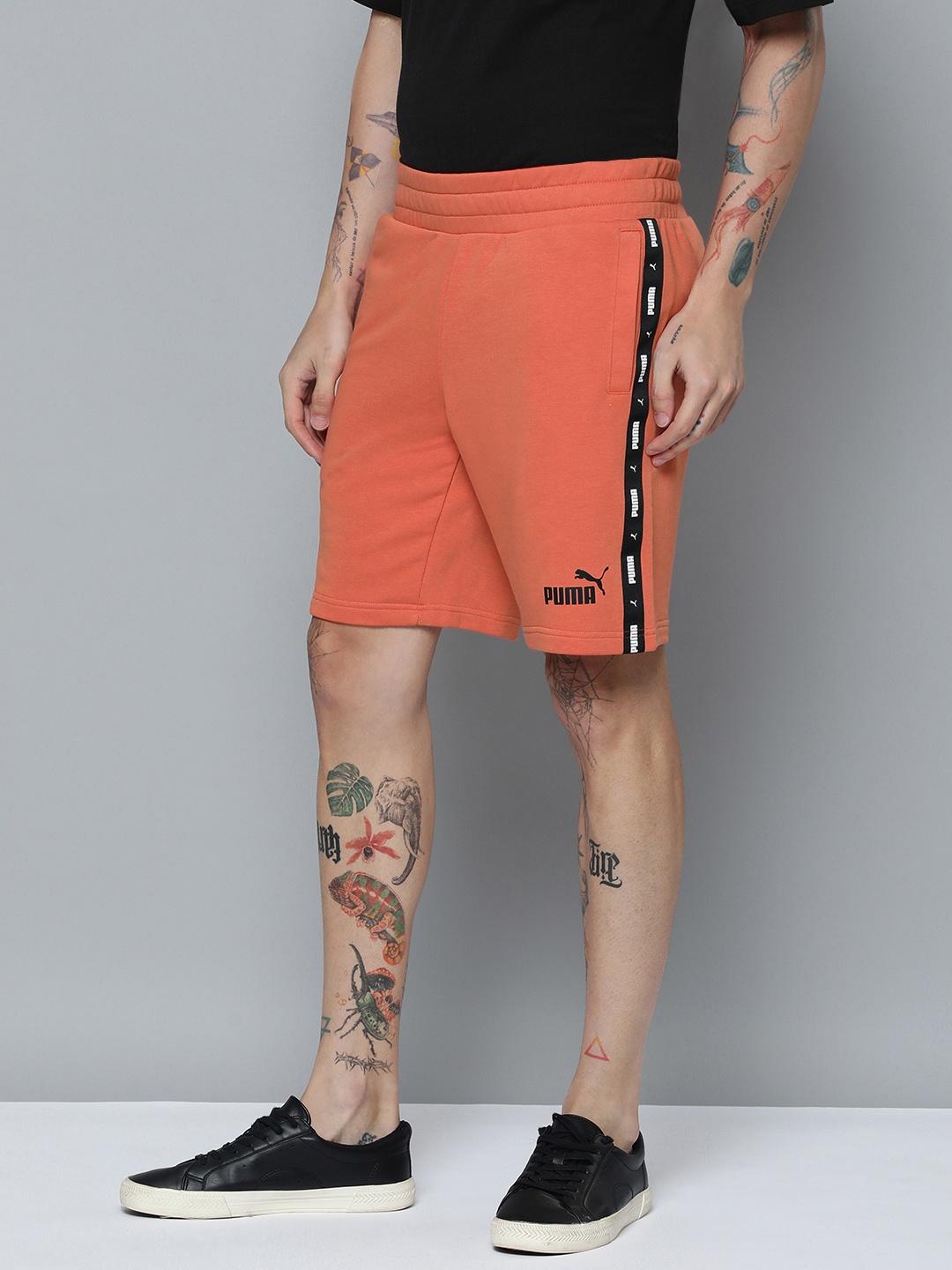

Puma Men Solid Essentials+ Tape Mid-Rise Regular fit Sport Shorts, Rust