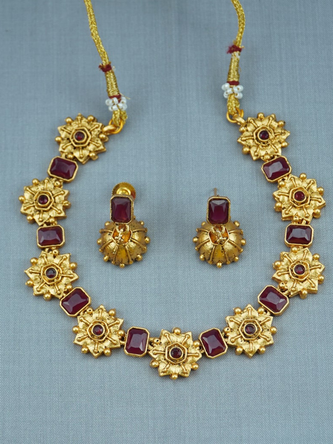 

Diksha collection Gold-Plated Stone-Studded Necklace & Earrings