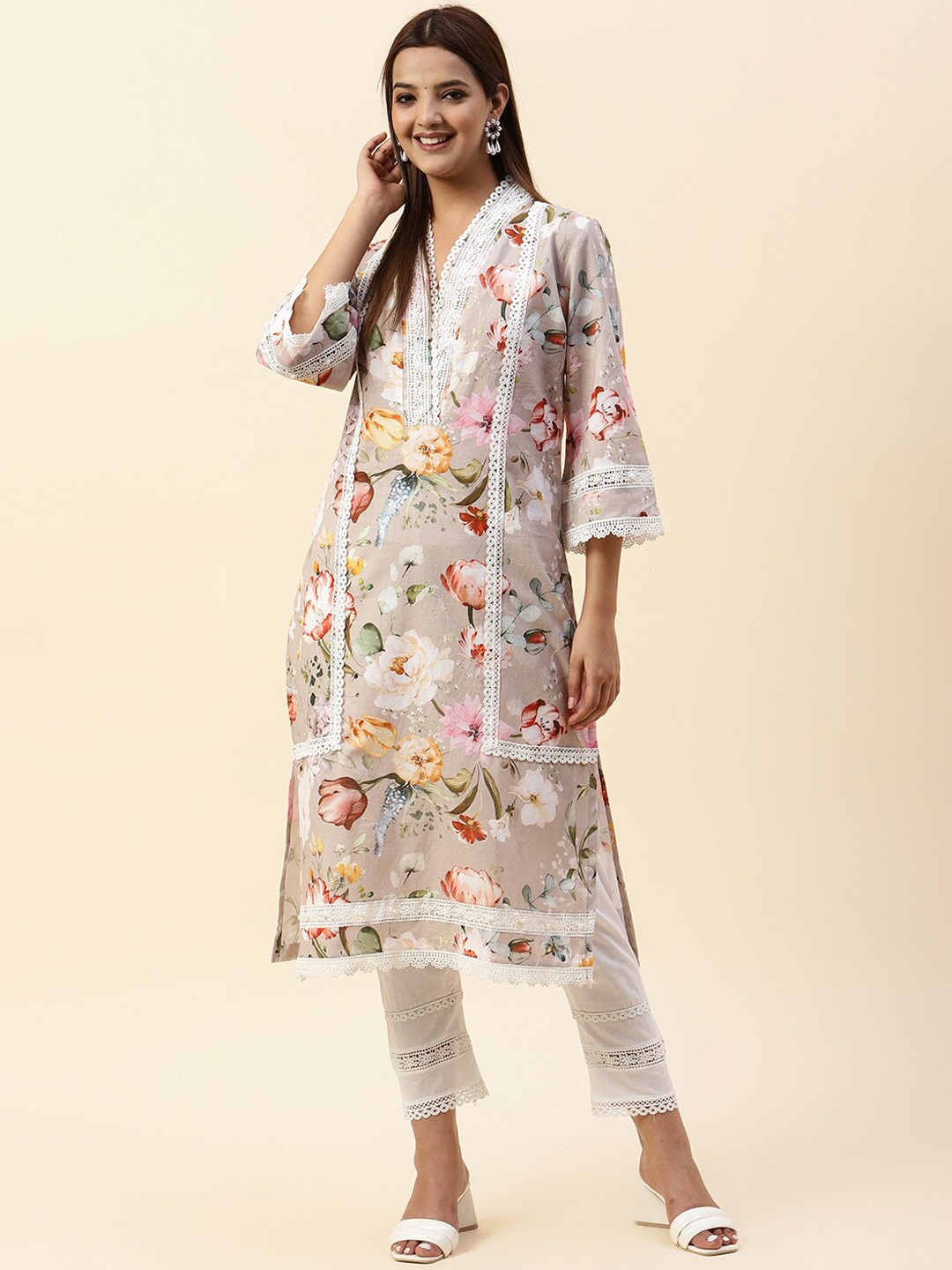 

Meena Bazaar Beige Floral Printed Regular Kurta With Trousers