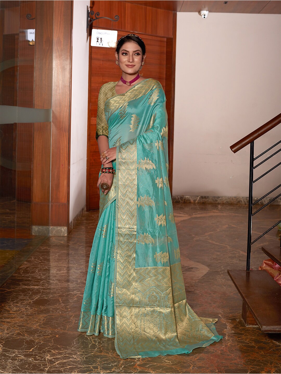 

Pisara Turquoise Blue & Gold-Toned Floral Woven Design Zari Organza Saree