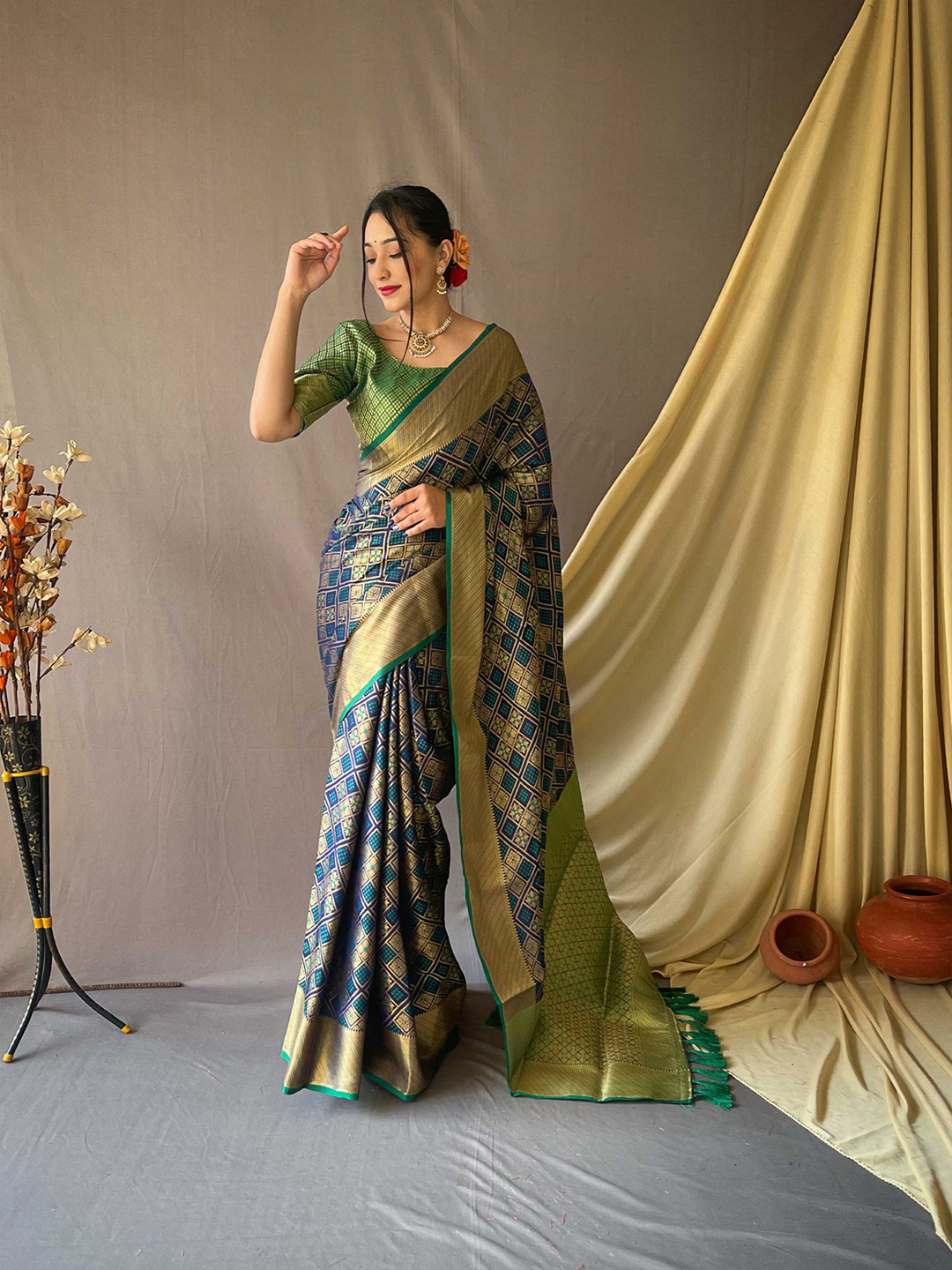

Mitera Navy Blue & Green Ethnic Motifs Woven Design Zari Silk Blend Patola Saree