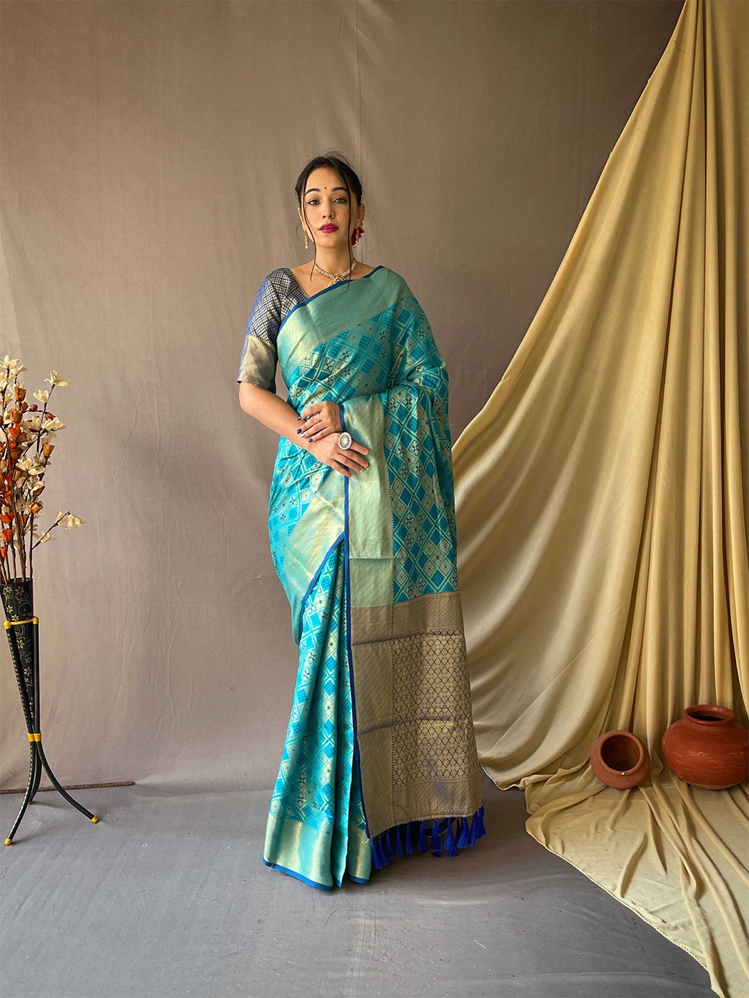 

Mitera Blue & Gold-Toned Ethnic Motifs Woven Design Zari Silk Blend Patola Saree