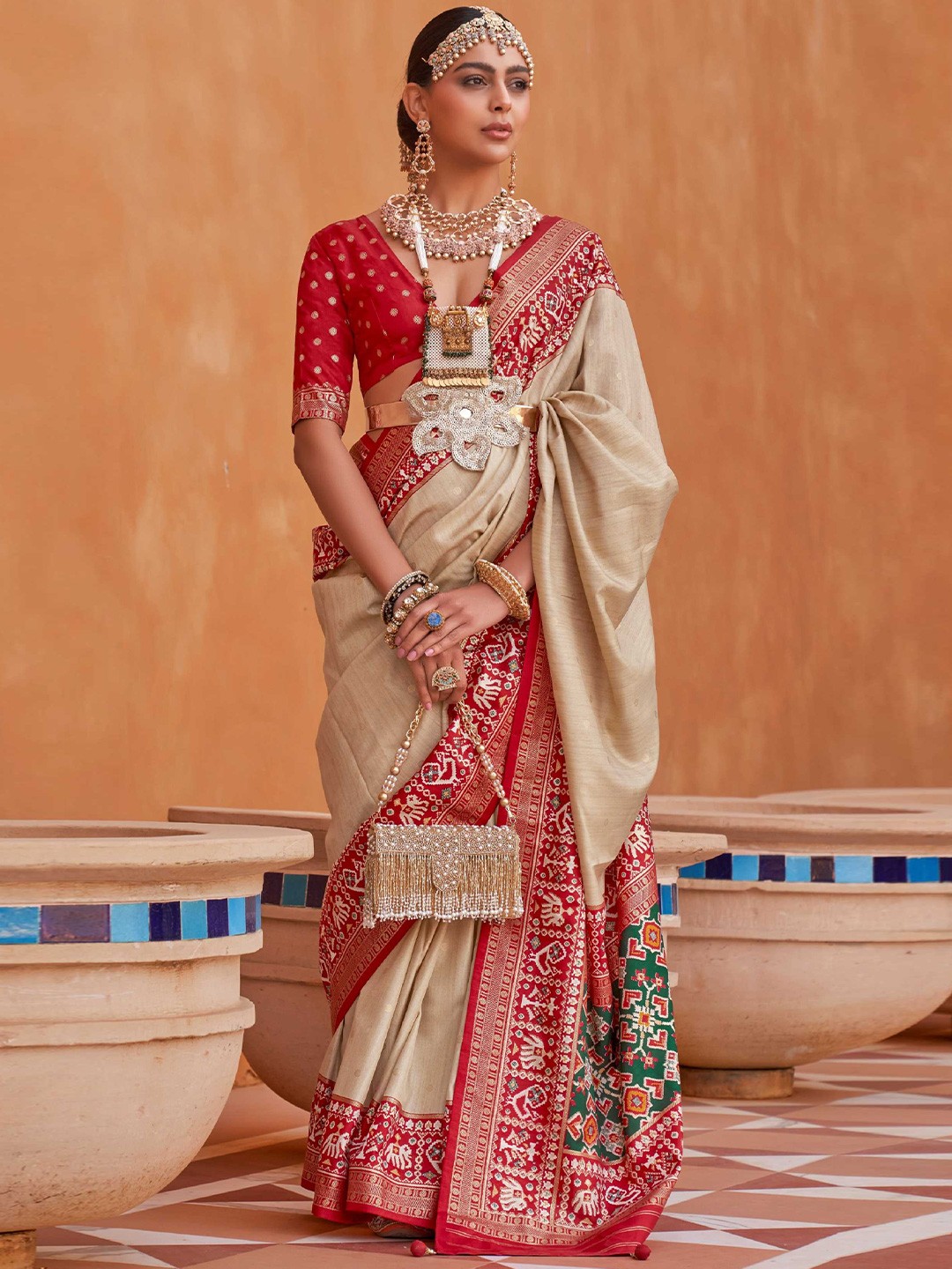 

Mitera Beige & Red Ethnic Motifs Woven Design Silk Blend Patola Saree