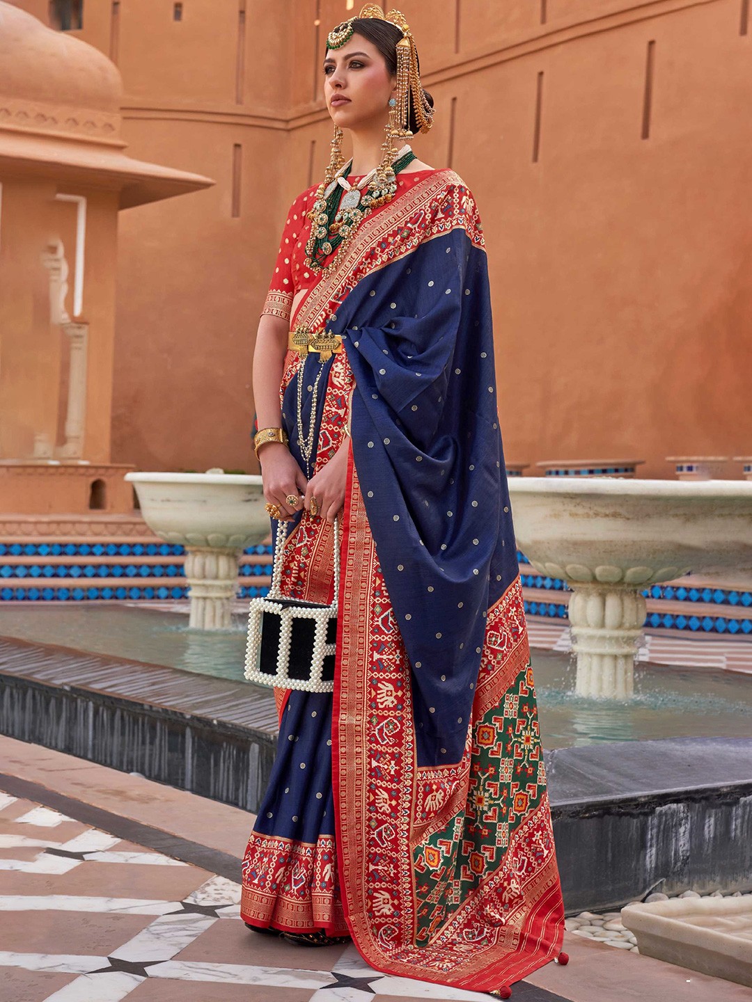 

Mitera Navy Blue & Red Ethnic Motifs Woven Design Silk Blend Patola Saree