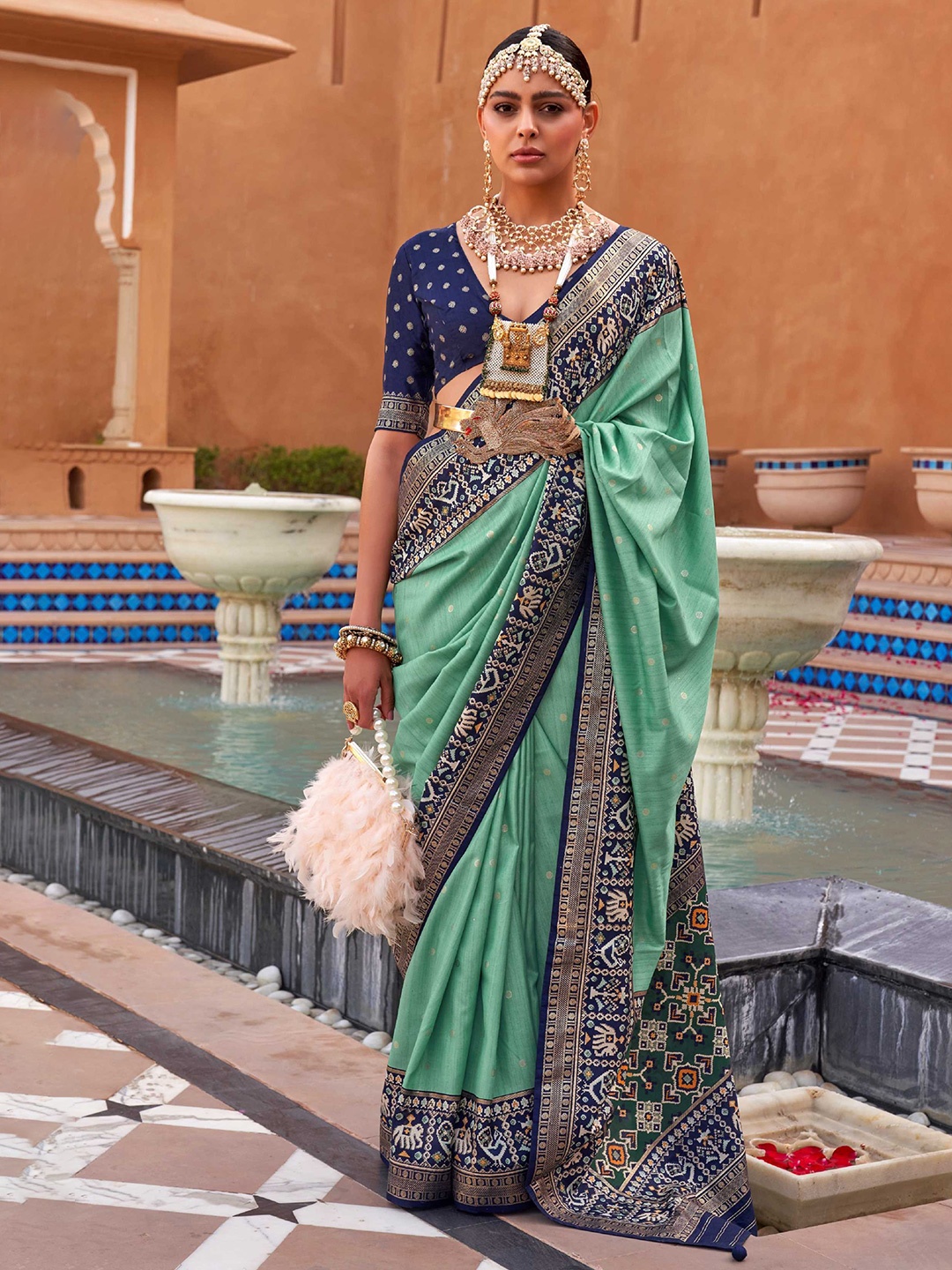 

Mitera Sea Green & Blue Ethnic Motifs Woven Design Silk Blend Patola Saree