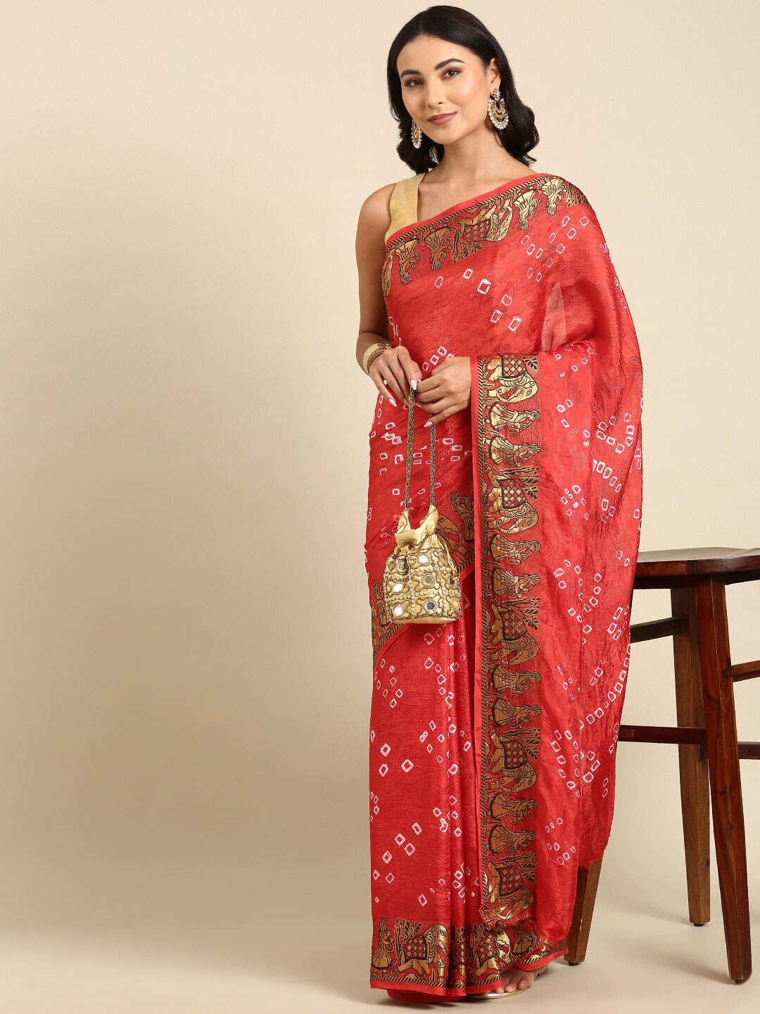 

Anouk Rust & White Bandhani Printed Saree