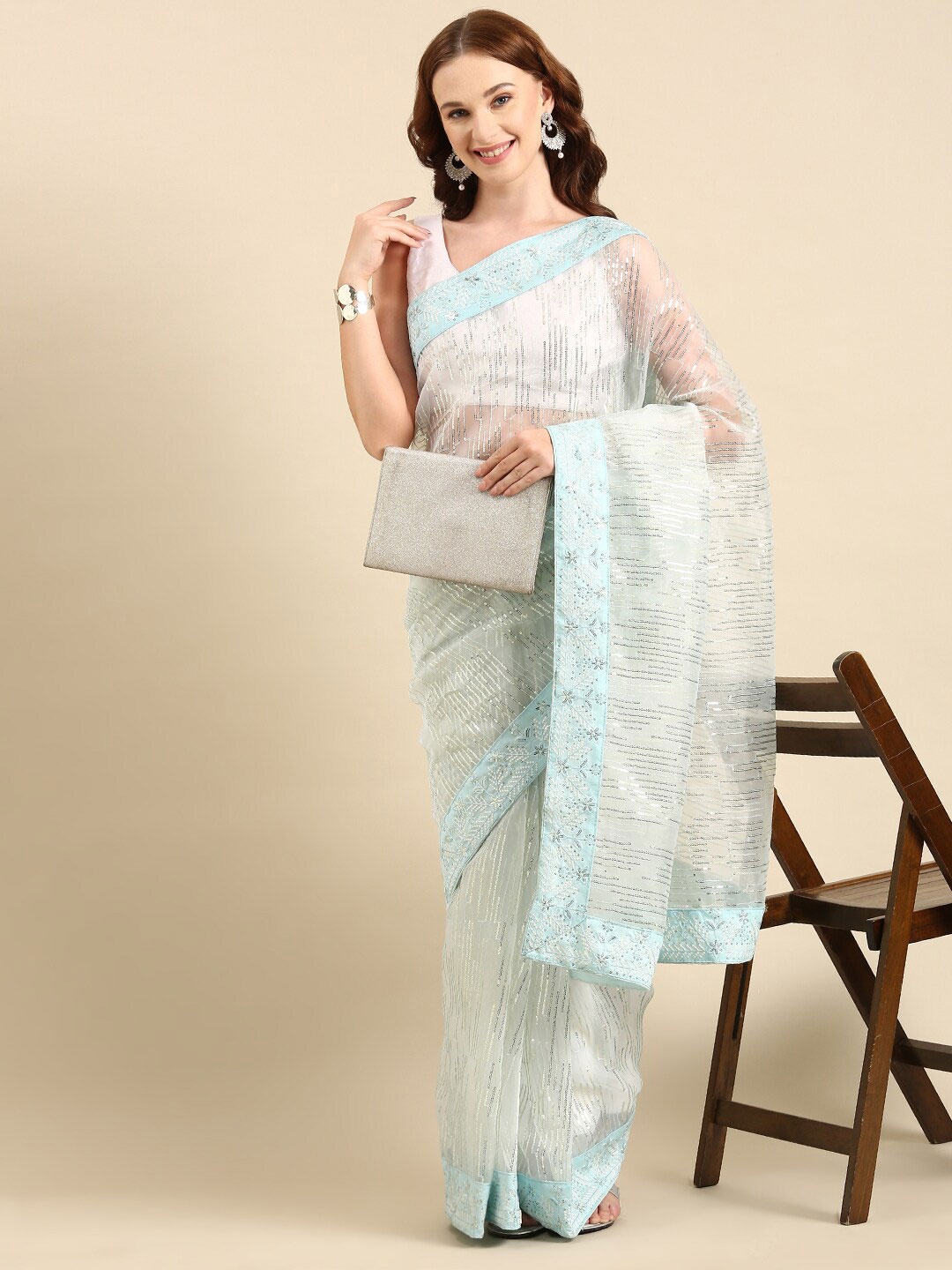 

Anouk Blue & Gold-Toned Sequin Embellished Organza Saree