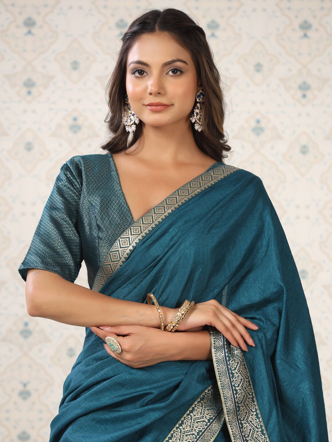 

Ode by House of Pataudi Teal & Gold-Toned Zari Poly Silk Saree